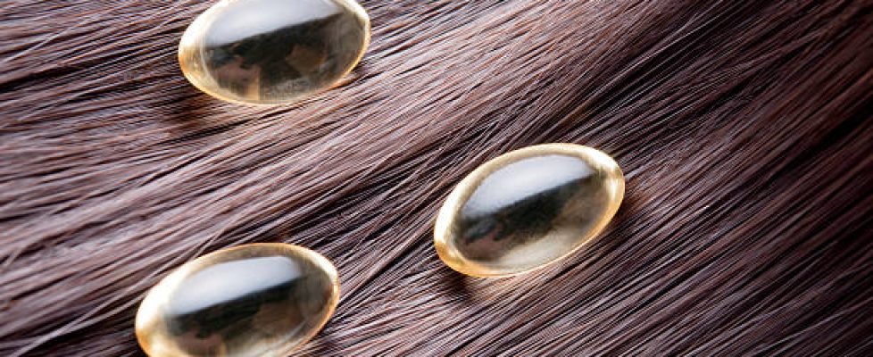 detailed close-up of hair with gel capsules over itRelated images: