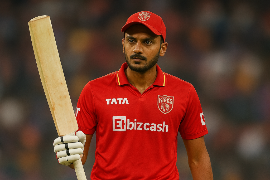 Axar Patel holding a cricket bat while playing for Punjab Kings in IPL, showcasing India’s spin-bowling all-rounder