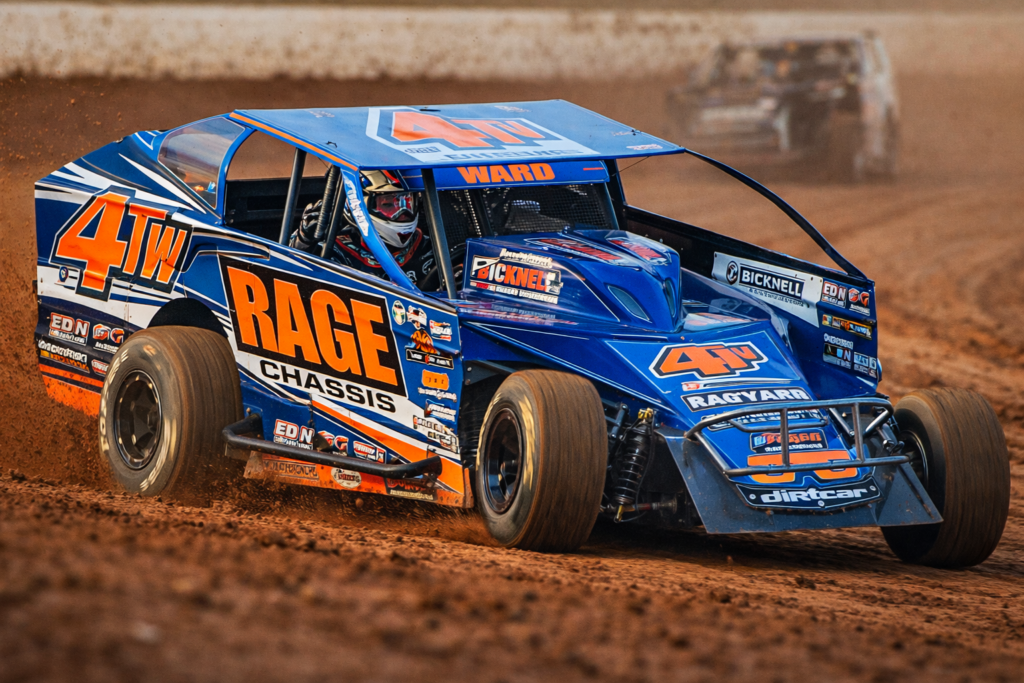 Tim Ward racing a dirt modified car during a DIRTcar Series event on a clay track
